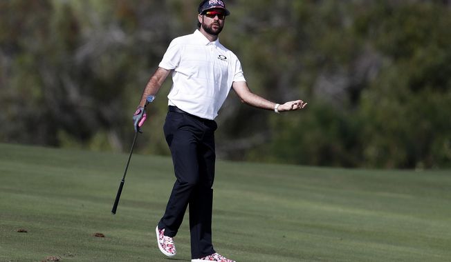 Bubba Watson reacts to his shot from the fourth fairway during the first round of the Tournament of Champions golf event, Thursday, Jan. 3, 2019, at Kapalua Plantation Course in Kapalua, Hawaii. (AP Photo/Matt York)
