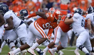 FILE - In this Sept. 15, 2018, file photo, Clemson&#39;s Clelin Ferrell (99) rushes into the backfield during the first half of the team&#39;s NCAA college football game against Georgia Southern in Clemson, S.C. Clemson’s defensive line came into the season with a ton of hype after Christian Wilkins, Austin Bryant and Ferrell all bypassed the chance to go to the NFL after 2017. Ferrell, an explosive pass rusher, has the most NFL upside. (AP Photo/Richard Shiro, File)