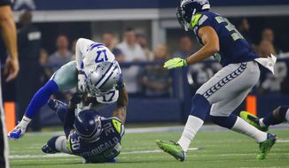 Dallas Cowboys wide receiver Allen Hurns (17) is hit by Seattle Seahawks strong safety Bradley McDougald (30) during the first half of the NFC wild-card NFL football game in Arlington, Texas, Saturday, Jan. 5, 2019. (AP Photo/Ron Jenkins)