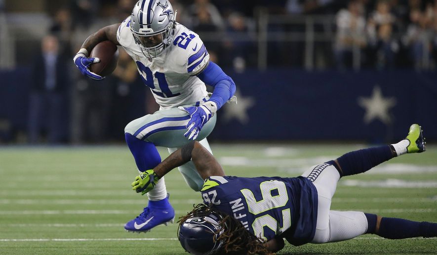 Dallas Cowboys running back Ezekiel Elliott (21) runs near Seattle Seahawks cornerback Shaquill Griffin (26) during the second half of the NFC wild-card NFL football game in Arlington, Texas, Saturday, Jan. 5, 2019. (AP Photo/Ron Jenkins)