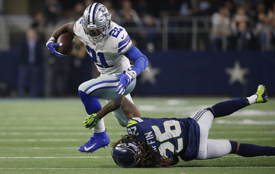 Dallas Cowboys running back Ezekiel Elliott (21) runs near Seattle Seahawks cornerback Shaquill Griffin (26) during the second half of the NFC wild-card NFL football game in Arlington, Texas, Saturday, Jan. 5, 2019. (AP Photo/Ron Jenkins)