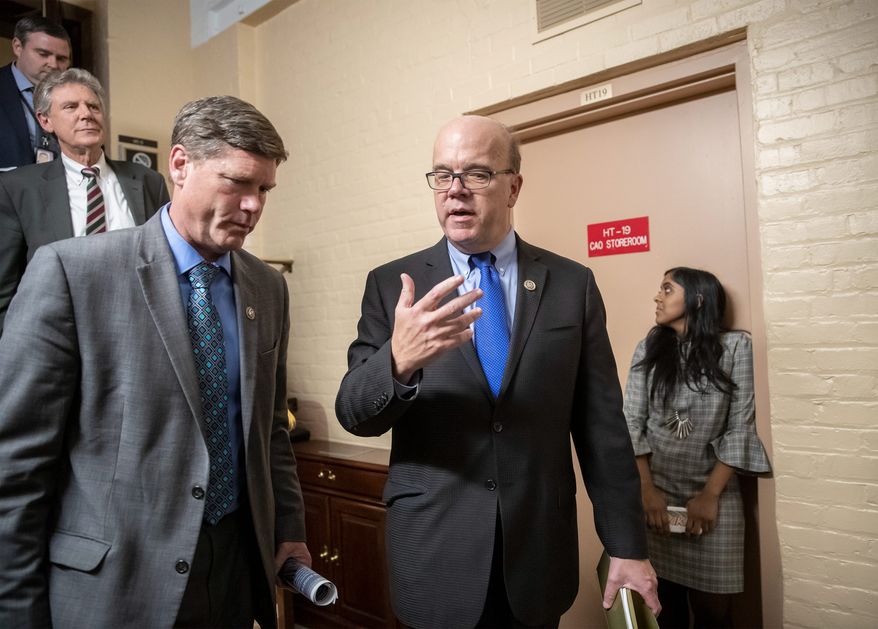Rep. James P. McGovern, D-Mass. center, the top Democrat on the House Rules Committee, talks with Rep. Ron Kind, D-Wis., left, joined at far left by Rep. Frank Pallone, D-N.J., as they exit a Democratic Caucus meeting in the basement of the Capitol as new members of the House and veteran representatives gathered behind closed doors to discuss their agenda when they become the majority in the 116th Congress, in Washington, Thursday, Nov. 15, 2018. Rep. McGovern will likely lead the Rules Committee that determines what bills are debated on the floor and what amendments are allowed to be voted on. (AP Photo/J. Scott Applewhite) ** FILE **