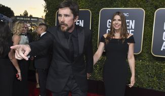 Christian Bale, left, gestures as he and Sibi Blazic arrive at the 76th annual Golden Globe Awards at the Beverly Hilton Hotel on Sunday, Jan. 6, 2019, in Beverly Hills, Calif. (Photo by Jordan Strauss/Invision/AP)