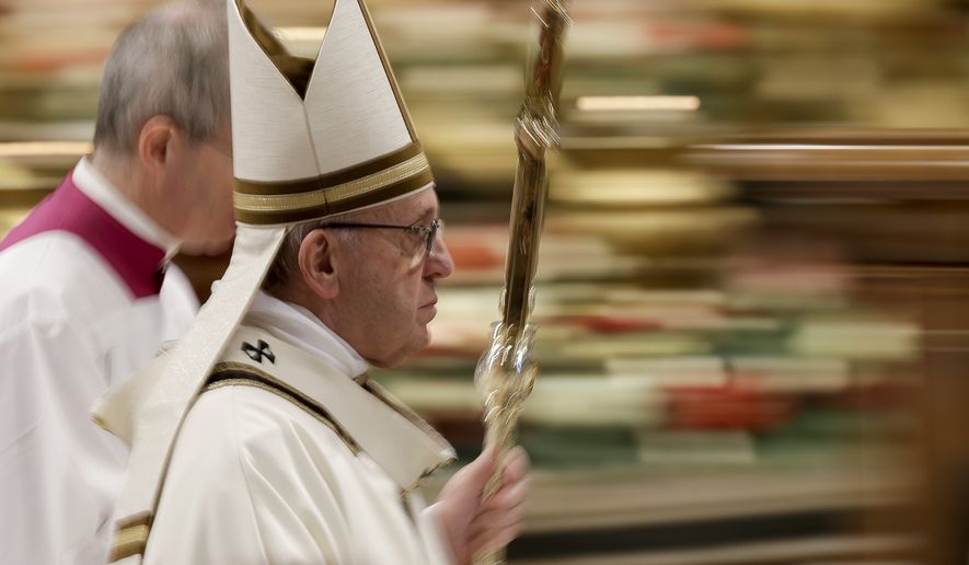 In this photo taken with slow shutter speed Pope Francis leaves after celebrating an Epiphany Mass in St. Peter's Basilica at the Vatican, Sunday, Jan. 6, 2019. Pope Francis has appealed to European leaders to show concrete solidarity to 49 migrants stranded aboard a pair of rescue vessels. Francis, addressing faithful in St. Peters Square Sunday, noted that the migrants, rescued in the Mediterranean. (AP Photo/Andrew Medichini)