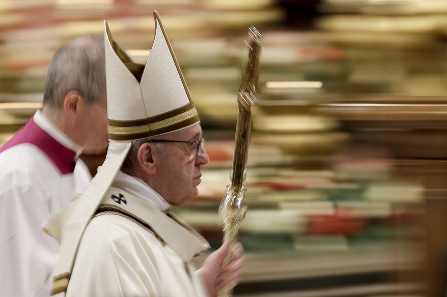 In this photo taken with slow shutter speed Pope Francis leaves after celebrating an Epiphany Mass in St. Peter's Basilica at the Vatican, Sunday, Jan. 6, 2019. Pope Francis has appealed to European leaders to show concrete solidarity to 49 migrants stranded aboard a pair of rescue vessels. Francis, addressing faithful in St. Peters Square Sunday, noted that the migrants, rescued in the Mediterranean. (AP Photo/Andrew Medichini)