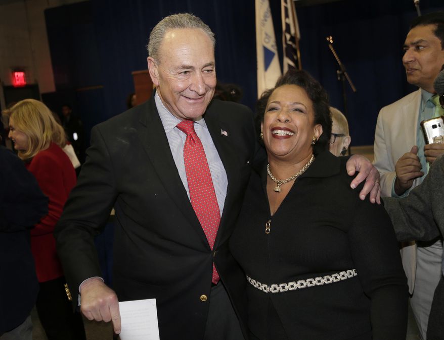 United States Senator Chuck Schumer greets former Attorney General Loretta Lynch during an inauguration ceremony for the new Attorney General of New York, Letitia James, in New York, Sunday, Jan. 6, 2019 (AP Photo/Seth Wenig)