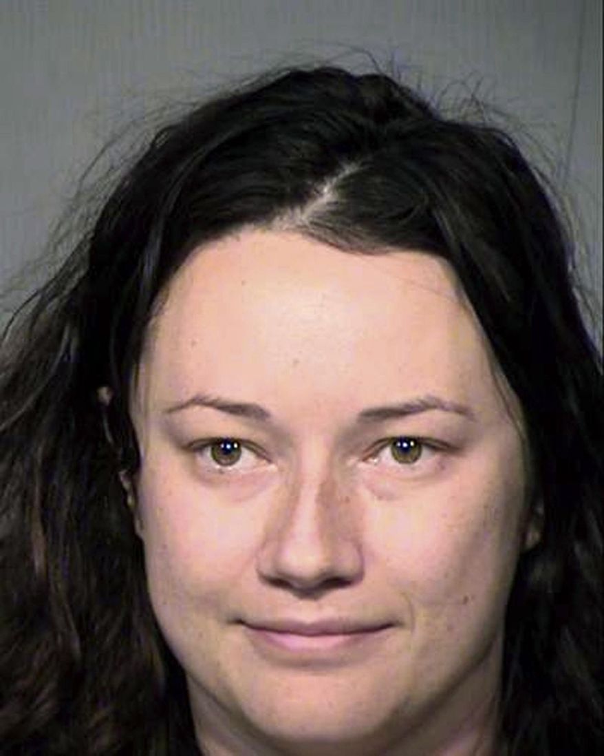 FILE - This undated file booking photo provided by the Maricopa County Sheriff's Office in Arizona shows Jacqueline Claire Ades. Ades, accused of stalking a man she met on a dating site and sending him more than 65,000 text messages, apparently sent more than twice that many. Ades has pleaded not guilty to charges of stalking and criminal trespassing. Her trial is scheduled to begin in February 2019. (Maricopa County Sheriff's Office via AP, File)