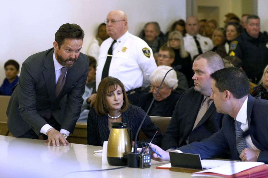 Attorneys for actor Kevin Spacey, Alan Jackson, left, and Juliane Balliro, second from left, confer with assistant district attorney Michael Giardino, far right, in district court during Spacey's arraignment on Monday, Jan. 7, 2019, in Nantucket, Mass. The Oscar-winning actor is accused of groping the teenage son of a former Boston TV anchor in 2016 in the crowded bar at the Club Car in Nantucket. (Nicole Harnishfeger/The Inquirer and Mirror via AP, Pool)