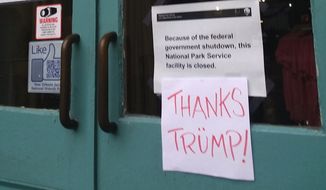 Tourists at the New Orleans Jazz National Historical Park, whose office adjoins Jean Lafitte&#39;s National Park Service headquarters, were met with a sign about the federal government shutdown. Below it, a handwritten sign read &quot;Thanks Trump,&quot; with a waggish umlaut over the &quot;u.&quot; (Photo by James Varney/The Washington Times)