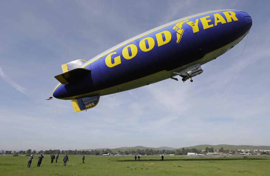 FILE - In this Friday, Feb. 5, 2016, file photo, the Goodyear Blimp Spirit of Innovation takes off for a flight over Super Bowl fan sites from the airport in Livermore, Calif. As a nod to its influence and legacy to the game, the iconic airship is being inducted into the College Football Hall of Fame as an honorary member — the first non-player or coach to be inducted. The blimp's flight to fame began during the telecast for the 1955 Rose Bowl Game and has led to it being an eye in the sky at over 2,000 games, hovering above stadiums from coast to coast. (AP Photo/Eric Risberg, File)
