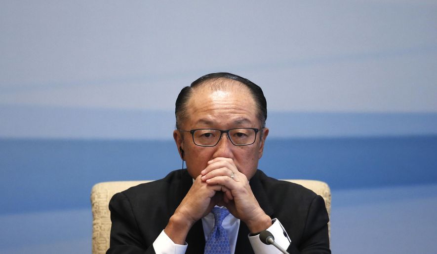 In this Sept. 12, 2017, file photo World Bank President Jim Yong Kim pauses during a joint press conference for the 1+6 Roundtable Dialogue at the Diaoyutai State Guesthouse in Beijing. (AP Photo/Andy Wong, File)