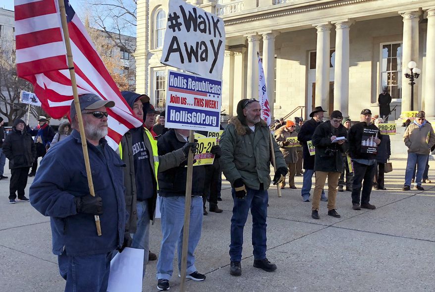 Second Amendment fans protest at the New Hampshire Statehouse in Concord. A firearms ban in the building prompted a GOP uprising. (Associated Press)