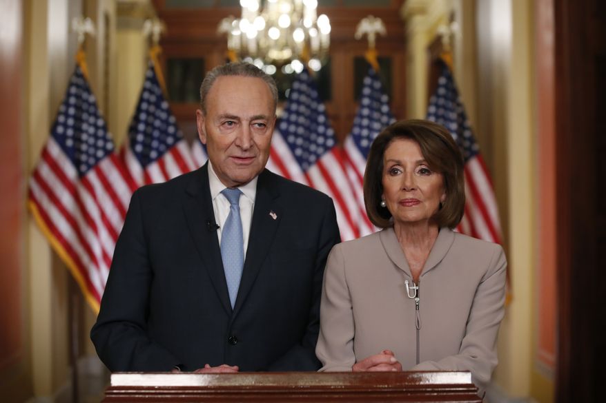 House Speaker Nancy Pelosi of Calif., and Senate Minority Leader Chuck Schumer of N.Y., pose for photographers after speaking on Capitol Hill in response President Donald Trump&#39;s prime-time address on border security, Tuesday, Jan. 8, 2019, in Washington. (AP Photo/Alex Brandon)