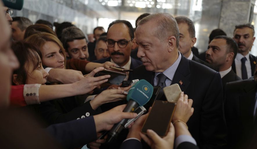 Turkey&#x27;s President Recep Tayyip Erdogan speaks to the media at the parliament in Ankara, Turkey, Tuesday, Jan. 8, 2019. Erdogan said Turkey&#x27;s preparations for a new military offensive against terror groups in Syria are &quot;to a large extent&quot; complete. Erdogan made the comments just hours after U.S. national security adviser John Bolton met with Turkish officials seeking assurances that Turkey won&#x27;t attack U.S-allied Kurdish militia in Syria. (AP Photo/Burhan Ozbilici)