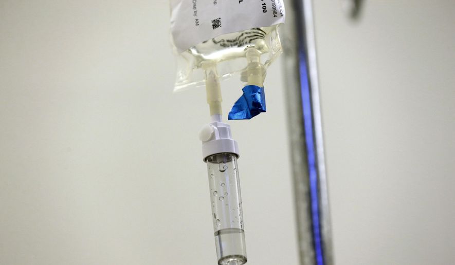 In this May 25, 2017, file photo, chemotherapy drugs are administered to a patient at a hospital in Chapel Hill, N.C. The U.S. cancer death rate has been falling between 1991 and 2016, and so far there’s little sign the decline is slowing, according to a report released on Tuesday, Jan. 8, 2019. (AP Photo/Gerry Broome)