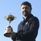 Padraig Harrington holds the Ryder Cup for the media at the Wentworth Golf Club, south England, Tuesday Jan. 8, 2019. Padraig Harrington has been chosen as captain of the Europe team for the 2020 Ryder Cup at Whistling Straits, it was announced by the European Tour at its headquarters at Wentworth. (Adam Davy/PA via AP)