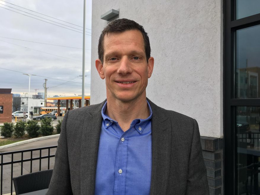 James Mackler poses for a portrait Tuesday, Jan. 8, 2018, in Nashville, Tenn. Mackler, a Democratic Nashville attorney and former Army helicopter pilot, is the first candidate to announce a 2020 bid for the seat Republican U.S. Sen. Lamar Alexander will leave after his term. (AP Photo/Jonathan Mattise)