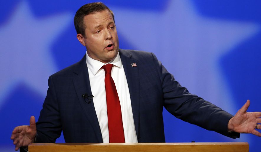 FILE - In this Oct. 2, 2018 file photo, Republican Corey Stewart gestures during a debate with U.S. Sen. Tim Kaine in Richmond, Va. Stewart who lost last year's U.S. Senate race to Democratic Sen. Tim Kaine, says he's leaving politics "until and unless the Commonwealth is ready" for his views. (AP Photo/Steve Helber, File)