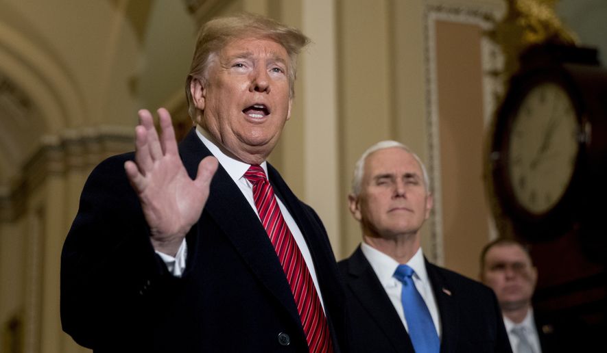 President Donald Trump, accompanied by Vice President Mike Pence, speaks to reporters as he arrives for a Senate Republican Policy lunch on Capitol Hill in Washington, Wednesday, Jan. 9, 2019. (AP Photo/Andrew Harnik)