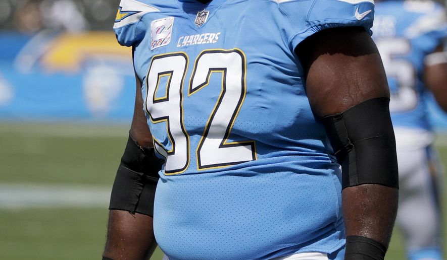 FILE - In this Oct. 7, 2018 file photo Los Angeles Chargers defensive tackle Brandon Mebane warms up before an NFL football game against the Oakland Raiders in Carson, Calif. Mebane is likely to play for the Chargers this week following the death of 7-week old daughter. Makenna Mebane died on Jan. 3. She was born on Nov. 12 with a defective heart condition. The Chargers defensive end was in Omaha, Nebraska, with his wife, Amena, and other two children, 4-year-old Mahailey and 2-year-old Makai, for most of the past two months while Makenna received treatment for a stomach infection. (AP Photo/Jae C. Hong, file)