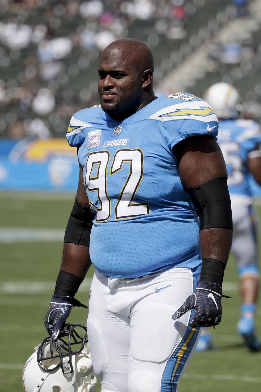 FILE - In this Oct. 7, 2018 file photo Los Angeles Chargers defensive tackle Brandon Mebane warms up before an NFL football game against the Oakland Raiders in Carson, Calif. Mebane is likely to play for the Chargers this week following the death of 7-week old daughter. Makenna Mebane died on Jan. 3. She was born on Nov. 12 with a defective heart condition. The Chargers defensive end was in Omaha, Nebraska, with his wife, Amena, and other two children, 4-year-old Mahailey and 2-year-old Makai, for most of the past two months while Makenna received treatment for a stomach infection. (AP Photo/Jae C. Hong, file)