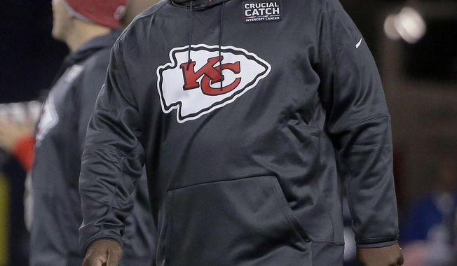 FILE - In this Oct. 14. 2018, file photo, Kansas City Chiefs offensive coordinator Eric Bieniemywalks on the field before the team&#x27;s NFL football game against the New England Patriot, in Foxborough, Mass. It was Doug Pederson a couple years ago. Matt Nagy last year. Now, it&#x27;s Eric Bieniemy that is juggling the roles of Chiefs offensive coordinator with the phone calls from teams searching for their next head coach. (AP Photo/Steven Senne, File)