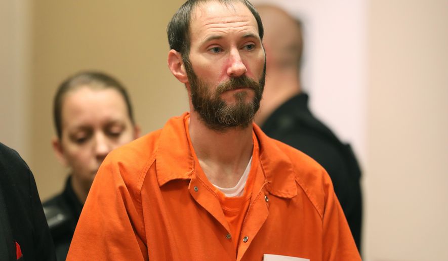 FILE - In this Dec. 14, 2018 file photo, Johnny Bobbitt stands during a hearing Burlington County Courthouse in Mt. Holly, N.J. A judge has issued an arrest warrant for Bobbitt, a homeless veteran charged with engaging in a GoFundMe scheme after he failed to make a scheduled court appearance. Bobbitt was due in a New Jersey court Tuesday, Jan. 8, 2019, to face charges that he violated court-ordered conditions that allowed for his release from jail while awaiting trial. (David Swanson /The Philadelphia Inquirer via AP, Pool, File)