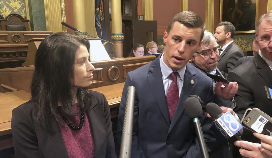 Republican House Speaker Lee Chatfield, right, and Democratic Attorney General Dana Nessel speak in support of newly introduced legislation that would curtail law enforcement's ability to take ownership of seized property in criminal cases, Wednesday, Jan. 9, 2019, in the House chamber in Lansing, Mich. The Legislature's two-year session opened Wednesday. (AP Photo/David Eggert)