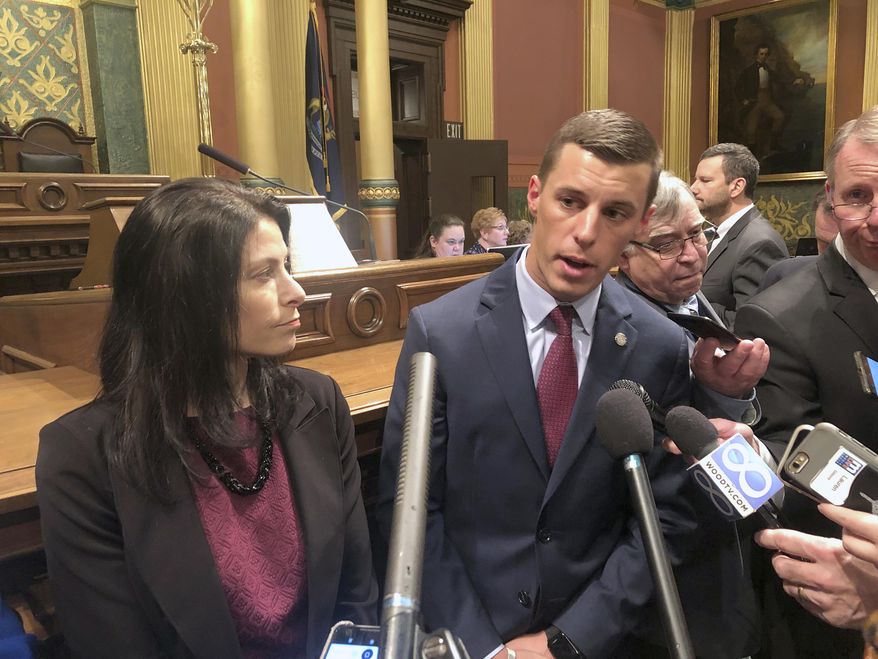 Republican House Speaker Lee Chatfield, right, and Democratic Attorney General Dana Nessel speak in support of newly introduced legislation that would curtail law enforcement's ability to take ownership of seized property in criminal cases, Wednesday, Jan. 9, 2019, in the House chamber in Lansing, Mich. The Legislature's two-year session opened Wednesday. (AP Photo/David Eggert)