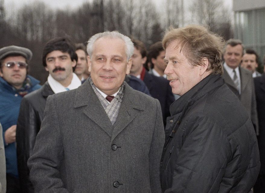 FILE - In this Wednesday, Feb. 28, 1990 file photo, Former Czechoslovak President Vaclav Havel, right, is met at airport by Russian Vice President Anatoly Lukyanov on arrival in Moscow. Anatoly Lukyanov, the speaker of the Soviet parliament who joined a hard-line coup that precipitated the Soviet collapse, has died at 88. Russia's Channel One state television said Lukyanov died Wednesday, Jan. 9, 2019. (AP Photo/Boris Yurchenko, File)