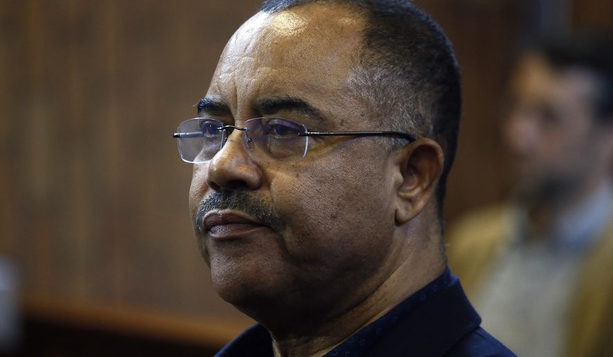 In this photo taken Tuesday, Jan. 8, 2019, former Mozambican finance minister, Manuel Chang, in court in Kempton Park, Johannesburg, South Africa. Chang is trying to avoid being extradited from South Africa to the United States over a dollars 2 billion loan scandal that plunged Mozambique into financial crisis. (AP Photo/Phill Magakoe)