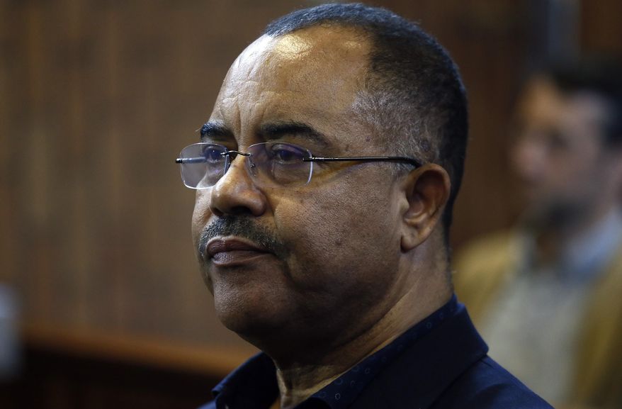 In this photo taken Tuesday, Jan. 8, 2019, former Mozambican finance minister, Manuel Chang, in court in Kempton Park, Johannesburg, South Africa. Chang is trying to avoid being extradited from South Africa to the United States over a dollars 2 billion loan scandal that plunged Mozambique into financial crisis. (AP Photo/Phill Magakoe)