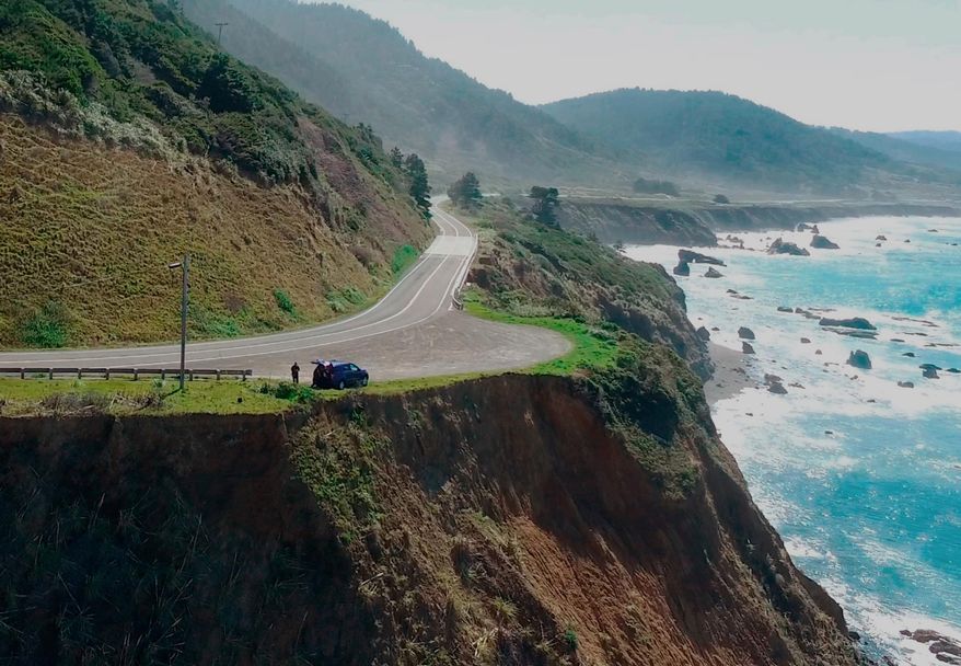 FILE - This March 28, 2018, aerial file photo taken from Alameda County Sheriff's Office drone video shows the pullout where the SUV of Jennifer and Sarah Hart was recovered off Pacific Coast Highway 1, near Westport, Calif. Authorities have positively identified human remains found on a Northern California beach as one of six children from a family killed when their SUV plunged off the cliff. The Mendocino County sheriff's department said Wednesday, Jan. 9, 2019, that the partial foot inside a shoe found on the beach belonged to 16-year-old Hannah Hart. Police say the six children and their parents died when Hart drove the SUV off the Pacific Coast Highway and over a 60-foot cliff into the ocean on March 26. (Alameda County Sheriff's Office via AP, File)