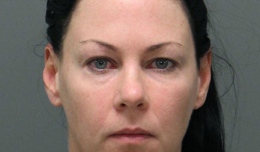 This December 2018 photo released by the Raleigh Police Department shows a booking photo of Amber Harrell. Raleigh police in North Carolina, said Harrell along with Jessica Fowler sexually assaulted a transgender woman at a Raleigh bar in December 2018. The women are charged with second-degree kidnapping and sexual battery. (Raleigh Police Department via AP)