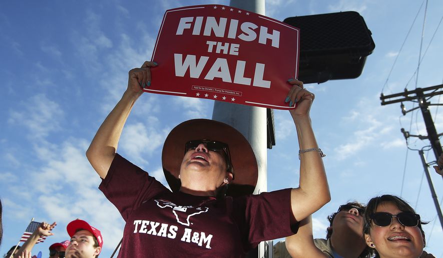 Supporters react during a visit by President Donald Trump at McAllen Miller International Airport in McAllen, Texas, Thursday, Jan. 10, 2019, in McAllen, Texas. (Joel Martinez/The Monitor via AP)