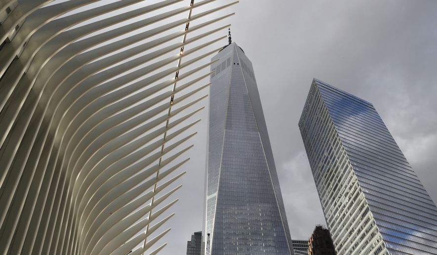 Parts of the Oculus, left, One World Trade Center, center, and 7 World Trade Center are seen from street level, Wednesday, Jan. 9, 2019, in New York. (AP Photo/Kathy Willens)