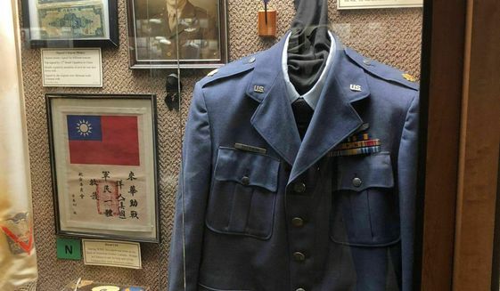 This undated photo provided by the Chennault Aviation and Military Museum in Monroe, La., shows an exhibit of artifacts from Maj. Richard Sherman, who flew 52 missions over China during World War II. Sherman was in the 11th Bomb Squadron of the Army&#39;s 14th Air Force under Gen. Claire Chennault, who nicknamed the 14th the Flying Tigers after the volunteer fighter group he had created while acting as a civilian advisor to nationalist China to defend that nation before the U.S. entered World War II. Sherman died Wednesday, Jan. 9, 2019, in Monroe. (Nell Calloway/Chennault Aviation and Military Museum via AP) **FILE**