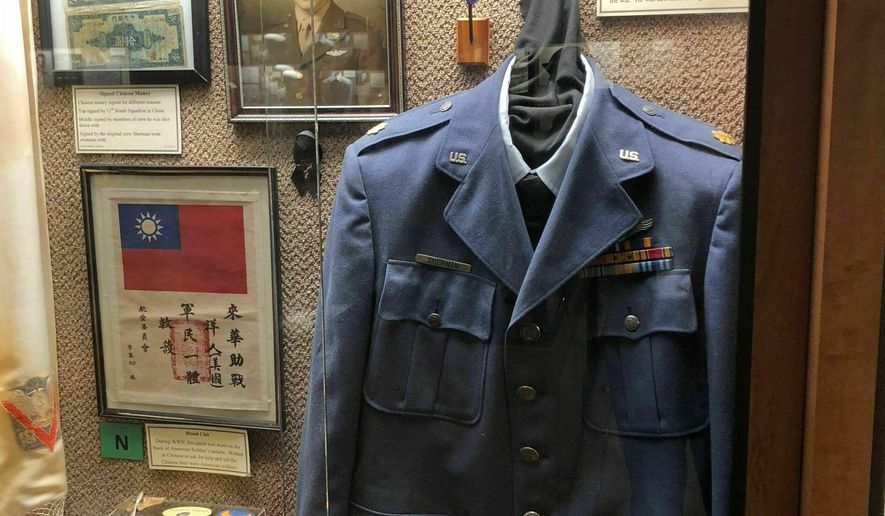 This undated photo provided by the Chennault Aviation and Military Museum in Monroe, La., shows an exhibit of artifacts from Maj. Richard Sherman, who flew 52 missions over China during World War II. Sherman was in the 11th Bomb Squadron of the Army&#x27;s 14th Air Force under Gen. Claire Chennault, who nicknamed the 14th the Flying Tigers after the volunteer fighter group he had created while acting as a civilian advisor to nationalist China to defend that nation before the U.S. entered World War II. Sherman died Wednesday, Jan. 9, 2019, in Monroe. (Nell Calloway/Chennault Aviation and Military Museum via AP) **FILE**