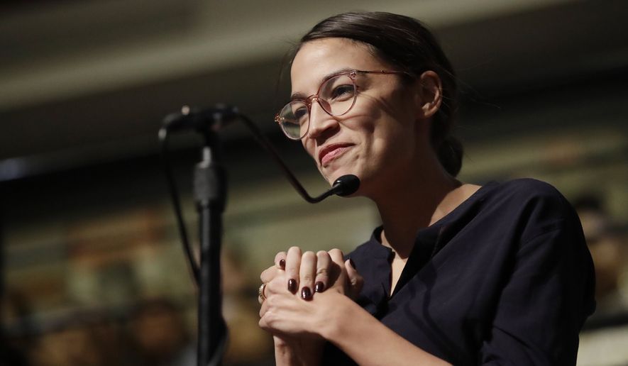 In this Dec. 6, 2018, file photo, Democrat Alexandria Ocasio-Cortez, who won her bid for a seat in the House of Representatives in New York&#x27;s 14th Congressional District, asks 2014 Nobel Laureate Malala Yousafzai a question at the Kennedy School&#x27;s Institute of Politics at Harvard University in Cambridge, Mass. (AP Photo/Charles Krupa) ** FILE **