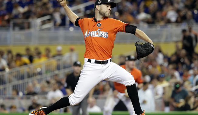 FILE - In this April 30, 2017, file photo, Miami Marlins relief pitcher David Phelps throws during the team&#x27;s baseball game against the Pittsburgh Pirates in Miami. A person familiar with the negotiations tells The Associated Press that right-hander Phelps and the Toronto Blue Jays have agreed to a $2.5 million, one-year contract. The person spoke on condition of anonymity Thursday night, Jan. 10, 2019, because the deal had not yet been announced. (AP Photo/Lynne Sladky, File)