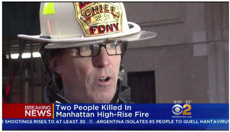 In this image taken from video and provided by WCBS-TV News, New York Fire Department Deputy Chief James Coyne speaks with members of the media after a deadly hi-rise fire, Saturday, Jan. 12, 2019 in New York. An elderly Manhattan couple died in the blaze that engulfed their luxury high-rise apartment before dawn. (WCBS-TV News via AP)