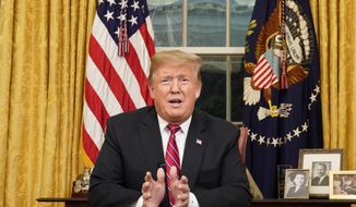 In this Jan. 8, 2019, photo, President Donald Trump speaks from the Oval Office of the White House as he gives a prime-time address about border security in Washington. (Carlos Barria/Pool Photo via AP) ** FILE **