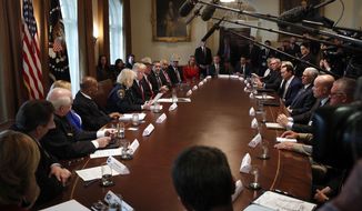 President Donald Trump, center left, leads a roundtable discussion on border security with local leaders, Friday Jan. 11, 2019, in the Cabinet Room of the White House in Washington. (AP Photo/Jacquelyn Martin)