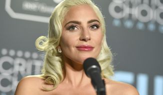 Lady Gaga, winner of the awards for best song for &quot;Shallow&quot; and best actress for &quot;A Star Is Born,&quot; poses in the press room at the 24th annual Critics&#39; Choice Awards on Sunday, Jan. 13, 2019, at the Barker Hangar in Santa Monica, Calif. (Photo by Jordan Strauss/Invision/AP)