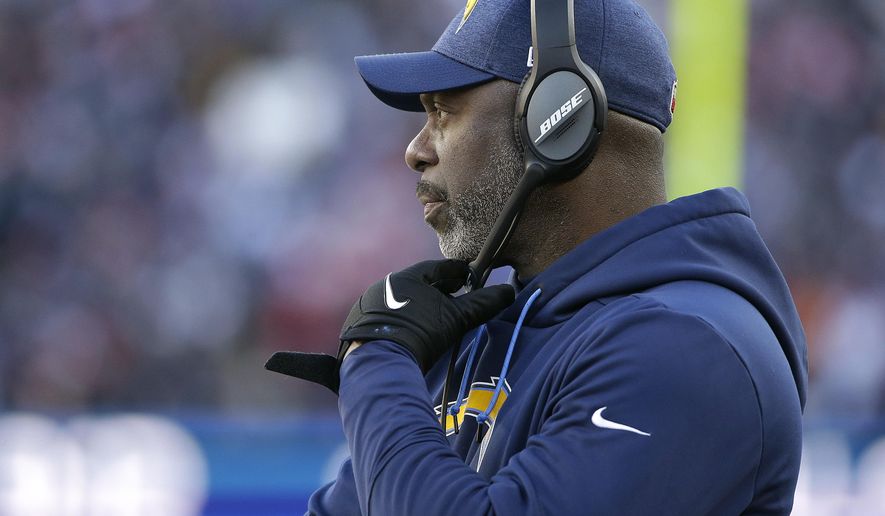 Los Angeles Chargers head coach Anthony Lynn watches from the sideline during the first half of an NFL divisional playoff football game against the New England Patriots, Sunday, Jan. 13, 2019, in Foxborough, Mass. (AP Photo/Steven Senne)
