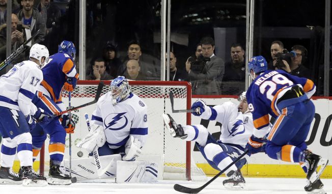 New York Islanders&#x27; Brock Nelson (29) shoots the puck past Tampa Bay Lightning goaltender Andrei Vasilevskiy (88) during the first period of an NHL hockey game Sunday, Jan. 13, 2019, in New York. (AP Photo/Frank Franklin II)