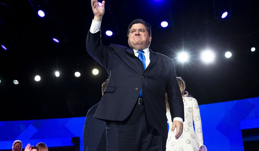Gov. J.B. Pritzker acknowledges the crowd after being sworn in as the state&#39;s 43rd governor during the Illinois inaugural ceremony Monday, Jan. 14, 2019 at the Bank of Springfield Center in Springfield, Ill. (Rich Saal/The State Journal-Register via AP)