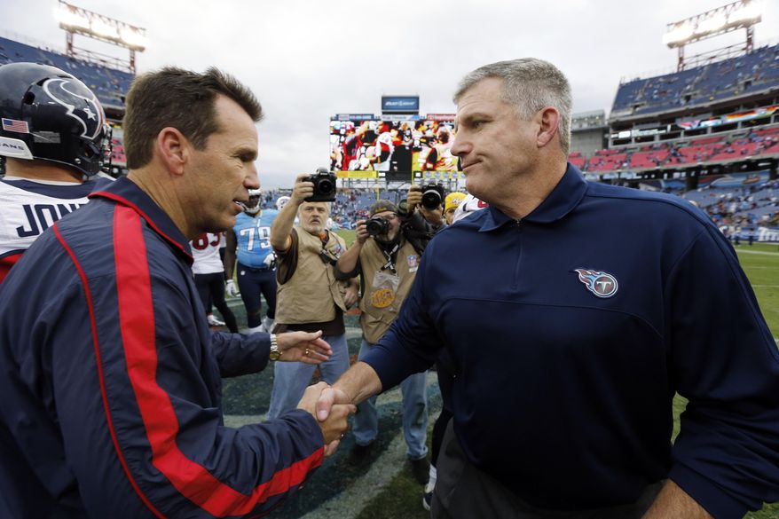 FILE - In this Dec. 2, 2012 file photo Tennessee Titans head coach Mike Munchak, right, congratulates Houston Texans head coach Gary Kubiak after an NFL football game in Nashville, Tenn. Munchak, who had been a finalist for the Denver Broncos head coaching job, is making a lateral move from the Pittsburgh Steelers to serve as the Broncos’ new offensive line coach, a person with knowledge of the agreement told The Associated Press on Monday, Jan. 14, 2019.The person also said the Broncos are allowing Gary Kubiak to interview elsewhere and have received permission to interview 49ers QBs coach Rich Scangarello for their offensive coordinator opening. (AP Photo/Joe Howell)