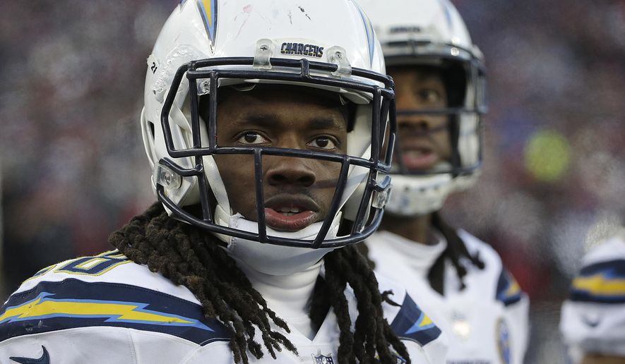 Los Angeles Chargers running back Melvin Gordon watches from the sideline during the second half of an NFL divisional playoff football game against the New England Patriots, Sunday, Jan. 13, 2019, in Foxborough, Mass. (AP Photo/Steven Senne)
