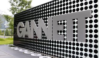 In this July 14, 2010, file photo, the Gannett Co.headquarters sign stands in McLean, Va. (AP Photo/Jacquelyn Martin, File)